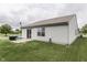 A home's backyard featuring a tidy lawn and a patio area for relaxing or entertaining at 933 Curlew Ln, Greenwood, IN 46143