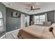 Comfortable bedroom with neutral walls, a ceiling fan, and natural light at 933 Curlew Ln, Greenwood, IN 46143