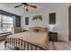 Serene bedroom with a ceiling fan, neutral decor, and a view of the outdoors at 933 Curlew Ln, Greenwood, IN 46143