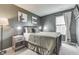 Cozy bedroom with natural light, neutral tones, and contemporary decor at 933 Curlew Ln, Greenwood, IN 46143