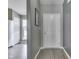 Clean entryway with gray walls, wood flooring, and a white front door at 933 Curlew Ln, Greenwood, IN 46143