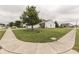 Wide view of the front lawn, sidewalk, and street in front of the house at 933 Curlew Ln, Greenwood, IN 46143