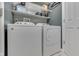Efficient laundry room features side by side washer and dryer at 933 Curlew Ln, Greenwood, IN 46143