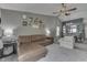 Well-decorated living room with vaulted ceilings, brown sectional, and view to dining area at 933 Curlew Ln, Greenwood, IN 46143