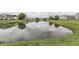 This scenic view showcases a serene pond reflecting the neighborhood's natural beauty at 933 Curlew Ln, Greenwood, IN 46143