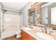 Bathroom featuring double sinks with modern fixtures and a shower-tub combo at 9358 W Rising Sun Dr, Pendleton, IN 46064