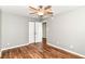 Bedroom with ceiling fan, wood-look flooring, and closet at 9358 W Rising Sun Dr, Pendleton, IN 46064