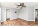 Bedroom featuring wood-look flooring, a ceiling fan, and neutral paint at 9358 W Rising Sun Dr, Pendleton, IN 46064