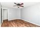 Bedroom featuring wood-look flooring, a ceiling fan, and neutral paint at 9358 W Rising Sun Dr, Pendleton, IN 46064