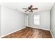 Bedroom with wood-look flooring, neutral paint, and a ceiling fan at 9358 W Rising Sun Dr, Pendleton, IN 46064