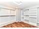 Walk-in closet with built-in storage and laminate flooring at 9358 W Rising Sun Dr, Pendleton, IN 46064