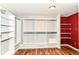 Walk-in closet with built-in shelving and laminate flooring at 9358 W Rising Sun Dr, Pendleton, IN 46064