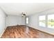 Living room featuring laminate floors and large windows with a waterfront view at 9358 W Rising Sun Dr, Pendleton, IN 46064