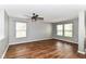 Spacious living room with windows and wood-look flooring at 9358 W Rising Sun Dr, Pendleton, IN 46064