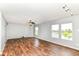 Living area featuring laminate floors and large windows with a lake view at 9358 W Rising Sun Dr, Pendleton, IN 46064