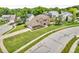 Aerial shot of the brick home showcasing its location in a residential neighborhood with mature trees at 9754 Bradford Knoll Dr, Fishers, IN 46037