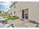 Back patio with a grill, table, and seating offers outdoor space for entertaining at 9754 Bradford Knoll Dr, Fishers, IN 46037