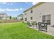 Back yard featuring a patio and seating area, ideal for outdoor relaxation and enjoyment at 9754 Bradford Knoll Dr, Fishers, IN 46037