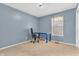 A simply decorated bedroom, with carpet flooring and a view through the window at 9754 Bradford Knoll Dr, Fishers, IN 46037