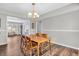 Bright dining room with classic wood furniture and a stylish chandelier offers a welcoming space for meals and gatherings at 9754 Bradford Knoll Dr, Fishers, IN 46037
