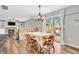 Inviting dining area with a charming table setting next to sliding glass doors that bring the outdoors in at 9754 Bradford Knoll Dr, Fishers, IN 46037