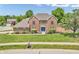 Charming brick home featuring a well-manicured lawn and classic architectural details at 9754 Bradford Knoll Dr, Fishers, IN 46037
