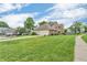 Beautiful two-story home with a well-manicured front yard and lush landscaping at 9754 Bradford Knoll Dr, Fishers, IN 46037