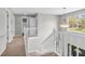 Upstairs hallway with large window and natural light at 9754 Bradford Knoll Dr, Fishers, IN 46037