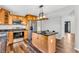 Efficient kitchen featuring stainless steel appliances and a functional center island is ready for cooking and entertaining at 9754 Bradford Knoll Dr, Fishers, IN 46037