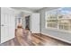 Bright open room with wood-look floors, neutral walls, and lots of natural light at 9754 Bradford Knoll Dr, Fishers, IN 46037