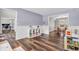 Inviting playroom features durable wood floors and cheerful pastel accents for creative play at 9754 Bradford Knoll Dr, Fishers, IN 46037
