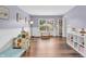 Sunlit playroom with wood floors offers ample space for learning and play, creating a bright and engaging environment at 9754 Bradford Knoll Dr, Fishers, IN 46037