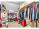 Spacious walk-in closet with built-in shelves and plenty of room for storage at 9754 Bradford Knoll Dr, Fishers, IN 46037