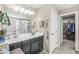 Bright bathroom featuring a double sink vanity, ample storage, and a walk-in closet at , Brownsburg, IN 46112