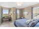 Cozy bedroom featuring a desk, plush carpet, and neutral walls with bright, natural light at , Brownsburg, IN 46112