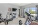 Well-lit exercise room featuring a treadmill and workout equipment with carpet flooring at , Brownsburg, IN 46112