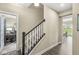 Bright hallway with staircase and views into the living and dining spaces at , Brownsburg, IN 46112