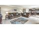Open living space with a plush sofa, adjacent dining area, and neutral decor at , Brownsburg, IN 46112