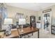 Inviting office space featuring a wooden desk, cozy lighting, and inspirational wall decor at , Brownsburg, IN 46112