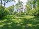 Lush green back yard, perfect for outdoor activities and relaxation at 10307 Wilson Rd, Brownsburg, IN 46112