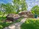 A charming backyard with a deck, storage shed and beautiful green lawn, perfect for relaxing and entertaining at 10307 Wilson Rd, Brownsburg, IN 46112