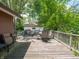 Spacious wooden deck with outdoor seating, ideal for entertaining and enjoying the backyard scenery at 10307 Wilson Rd, Brownsburg, IN 46112