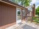 Exterior of house with wooden deck, back door, and chair creating a welcoming outdoor space at 10307 Wilson Rd, Brownsburg, IN 46112