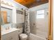 Bathroom featuring a tub and shower combination with decorative seashell-themed shower curtain and wooden ceiling at 10307 Wilson Rd, Brownsburg, IN 46112