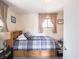 Bright bedroom with updated flooring, neutral decor, and lots of natural light at 10307 Wilson Rd, Brownsburg, IN 46112