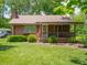 Charming single-story home with a covered front porch and well-maintained lawn at 10307 Wilson Rd, Brownsburg, IN 46112