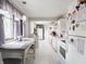 Bright kitchen with white cabinets, sleek countertops, and breakfast nook with natural light at 10307 Wilson Rd, Brownsburg, IN 46112