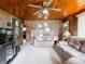Open-concept living area with ample seating and bright lighting, perfect for entertaining at 10307 Wilson Rd, Brownsburg, IN 46112