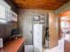 Home office featuring wood paneling, functional desk space, and modern fixtures at 10307 Wilson Rd, Brownsburg, IN 46112