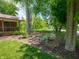 Scenic side yard with mature trees and natural foliage, offering privacy and tranquility at 10307 Wilson Rd, Brownsburg, IN 46112